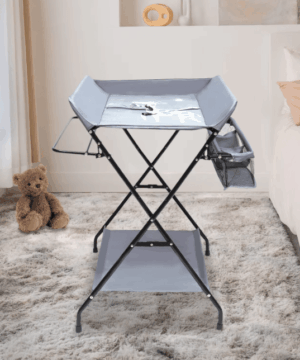 Foldable baby diaper changing table with 6.3-inch elevated fence, bottom storage board, and side storage basket for convenient and secure diaper changes.