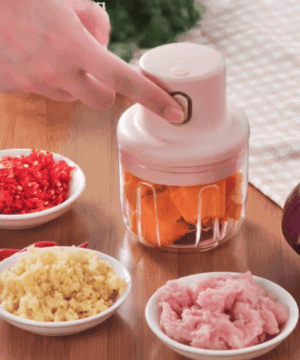 Mini electric garlic chopper with stainless steel blades, ideal for chopping garlic, vegetables, nuts, and more. Easy to clean and perfect for quick meal prep.